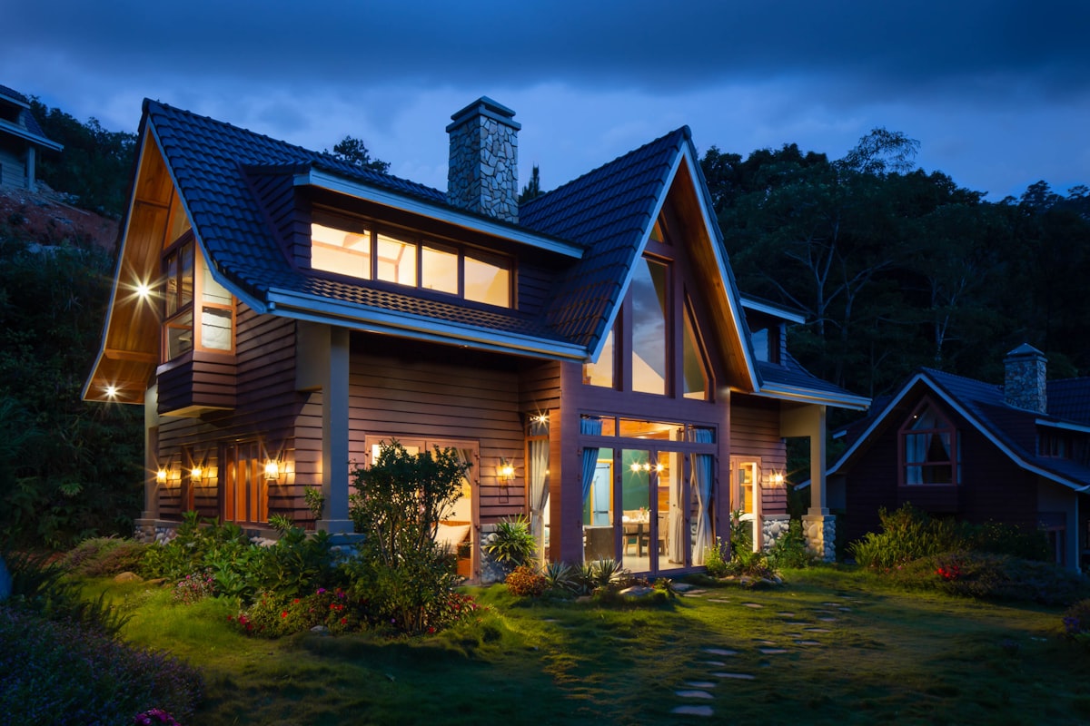 A warm, modern Australian family home glowing at dusk
