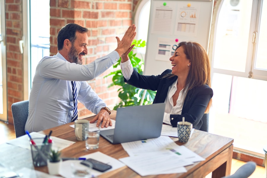 A friendly consultation between a broker and a client at a desk