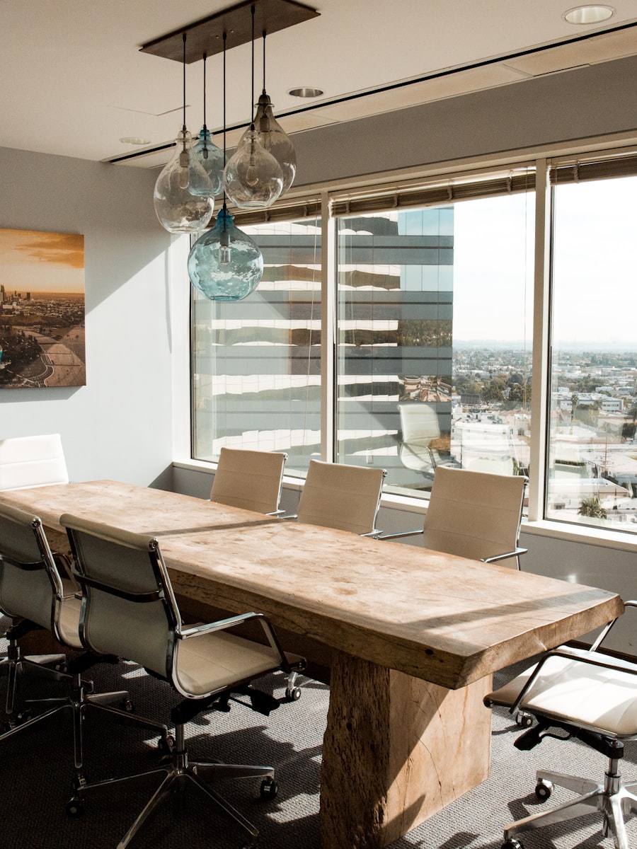 A calm, modern Spotto Finance meeting room with warm light and a city outlook